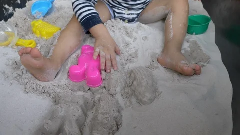 Slow motion, child playing sand in playground Stock Footage 95013039