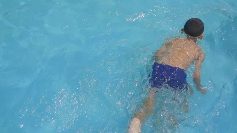 Slow motion child slide on slider in water park on summer holiday Stock Footage 88190867