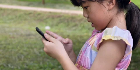 Slow motion child use mobile Stock Footage 162116674