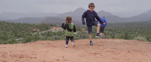 Slow Motion Children Dancing in the Desert with a Beautiful Background Stock Footage 61836116