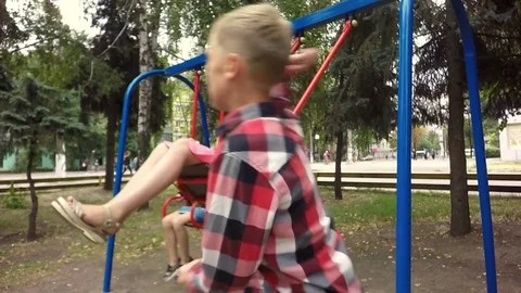 Slow motion. Children playing on playground in autumn 库存影片 79469711