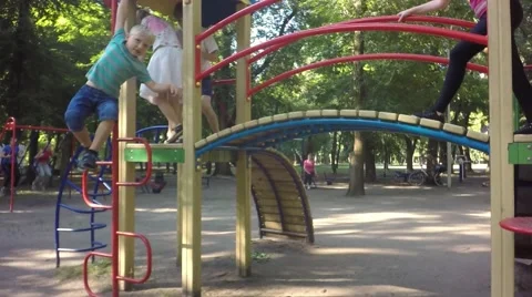 Slow motion. Children run around the playground. 库存影片 65076558