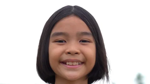 Slow motion children smiling on white sky background, happiness kids is lovely Stockbeeldmateriaal 179693608
