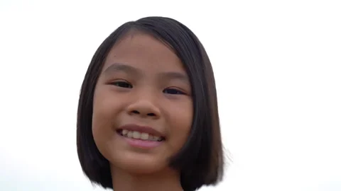 Slow motion children smiling on white sky background, happiness kids is lovely Vidéo 179700763