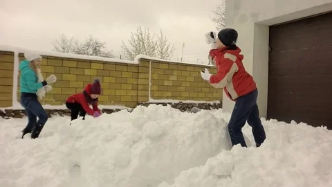 Slow motion. Children throw snow. Video stock 74666212