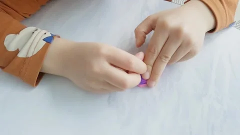 Slow motion, a child's hand playing with clay Stock Footage 304271872