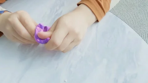 Slow motion, a child's hand playing with clay Stock Footage 304271879