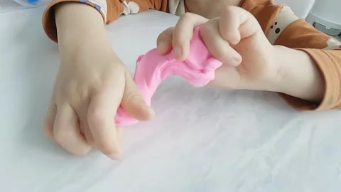 Slow motion, a child's hand playing with clay Stock Footage 304271891