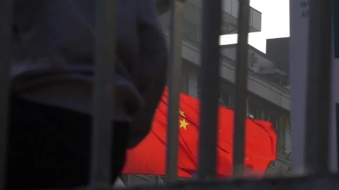Slow motion of China Flag background people passing by Stock Footage 97748164