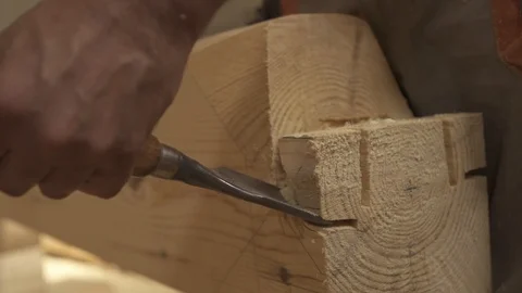 Slow motion chisel enters tree. shavings take off, a piece of wood breaks off Stock Footage 98120931