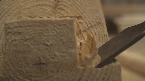 Slow motion chisel enters tree. shavings take off, a piece of wood breaks off Stock Footage 98120941
