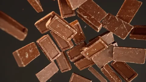 Slow motion of chocolate bar on a black background Stock Footage