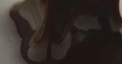 Slow Motion Chocolate Bar Falling into Liquid Chocolate - Rich Dessert Footage Stock Footage 276875154