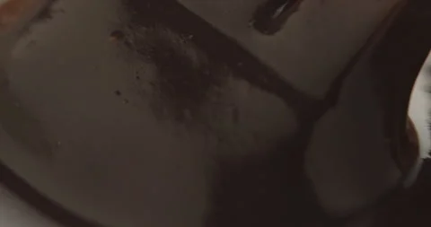 Slow Motion Chocolate Bar Falling into Liquid Chocolate - Rich Dessert Footage Stock Footage 276875292