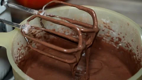 Slow Motion Chocolate Batter Dripping from Mixer Blades Stock-Footage 320393509