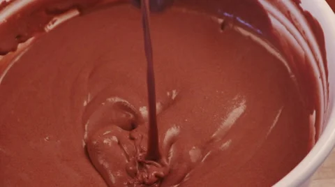 Slow motion of chocolate dessert dropping off a spoon Stock Footage 64694693