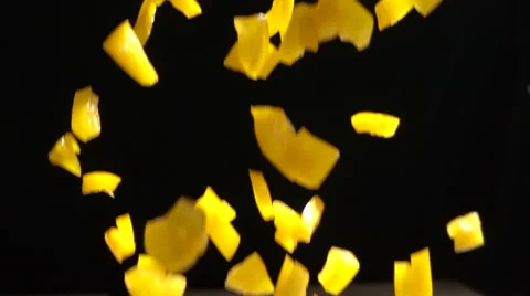 Slow Motion Chopped Yellow Bell Pepper falls Stock Footage 68672486
