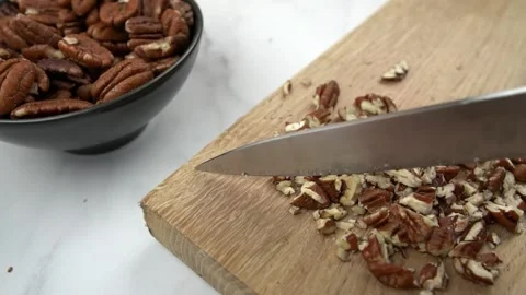 Slow motion chopping pecans Stock Footage 150278191