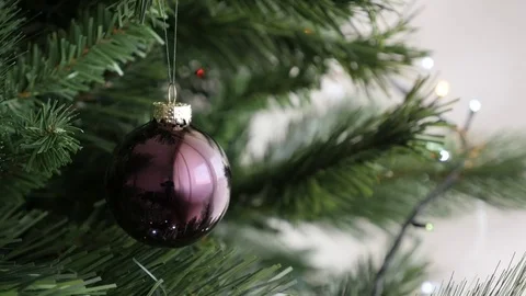 Slow motion of Christmas tree shiny bronze glass decorative ornament Stock Footage 72944612