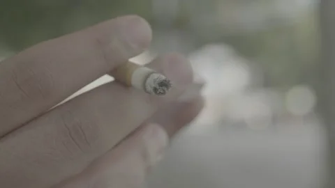 Slow motion of cigarette while texting Stock-Footage 133544282