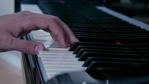 Slow motion cinematic camera movement on grand piano revealing musician's hands Stock Footage 304478203