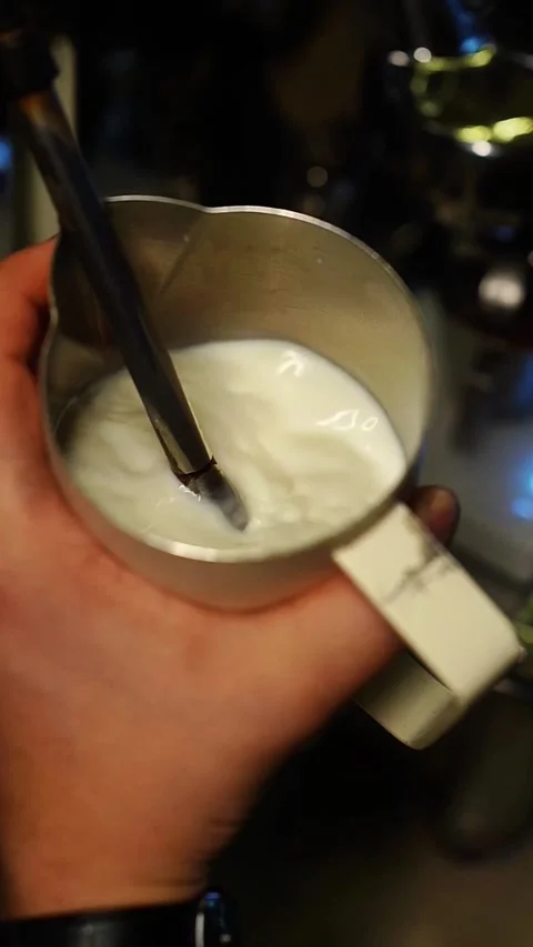 Slow motion cinematic coffee making sequence with milk art Stock Footage 311408006