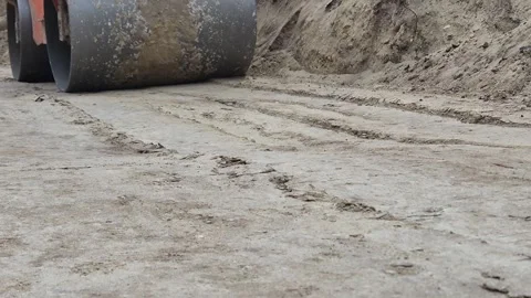 Slow Motion Cinematic Side Angle of Massive Steamroller Approaching - 4K Vídeos de archivo 331702224