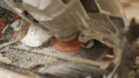 Slow motion circular saw rotation, sawdust, woodworking Video stock 153494074