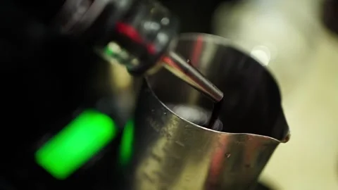 Slow motion circular syrup pour into tea pitcher with camera following motion Video stock 311667574