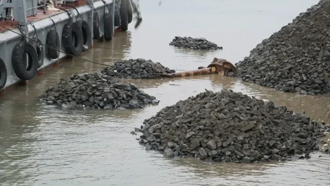 Slow motion. A clamshell crane on a floating platform works Stock Footage 114308637