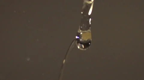Slow motion clear liquid pouring and splashing 1000 fps Stock Footage 55806838