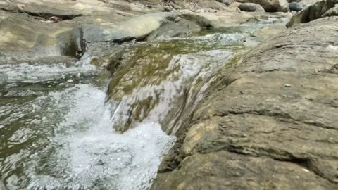 Slow motion of a clear mountain river during the dry season Stock Footage 321320283
