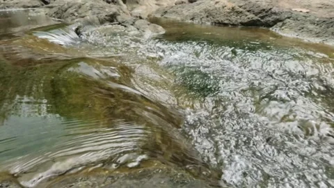 Slow motion of a clear mountain river during the dry season Stock Footage 321320284