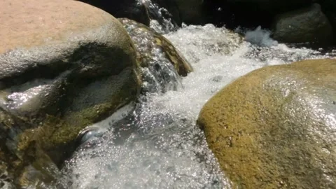 Slow motion of a clear mountain river cascade Stock Footage 321861538