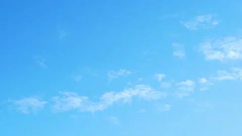 Slow Motion Clear Pure Azure Sky with Soaring White Light Fluffy Clouds on a Sun Stock Footage 224853073