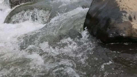 Slow motion of clear river water flow Video stock 306672952