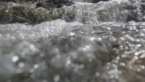 Slow motion of a clear waterfall flowing Stock Footage 306760113