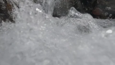 Slow motion of clear waterfall splashes 動画素材 306757777