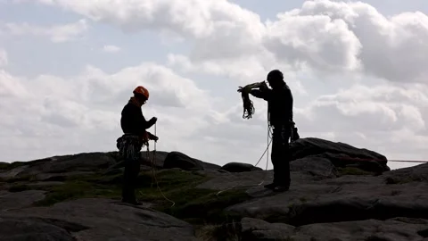 Slow motion climbers coiling ropes Stock Footage 143380841
