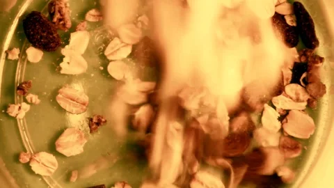 Slow motion clip of cereal being poured into a bowl Stock Footage 87857570