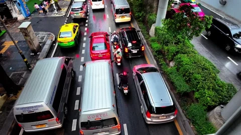 Slow motion clip of early evening traffic on Sukhumvit Road Stock Footage 297065952