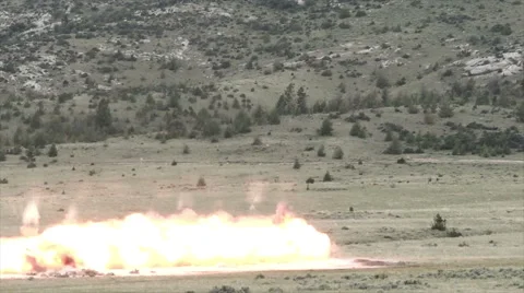 Slow motion clip of long range shot of large explosion. Stock Footage 52702724
