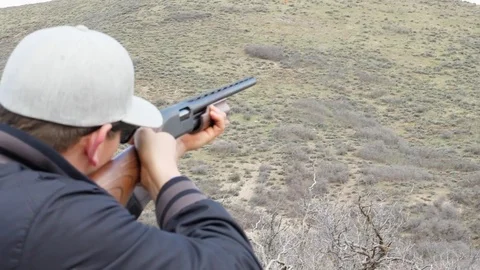 Slow-Motion Clip Of A Man Shooting A Clay Pigeon Stock Footage