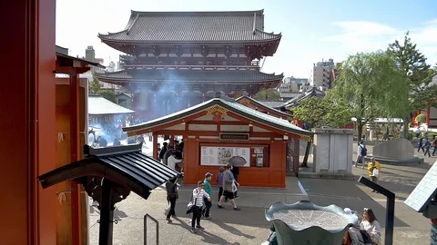 A slow motion clip of the people inside the Senso-ji temple in Tokyo Japan Stock Footage 129280046