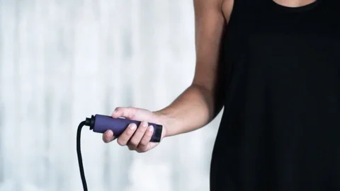 SLOW MOTION CLOSE UP Arm of young woman skipping jump rope Stock Footage 112653278