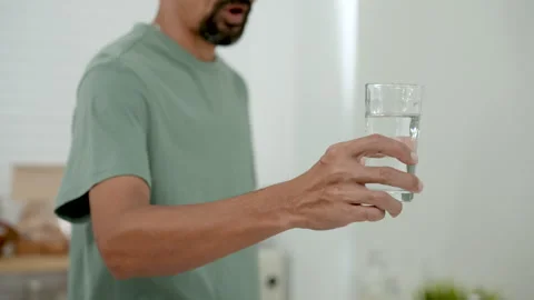 Slow motion, Close-up Asian man's hands, drinking glass handles that Stock Footage 241241708