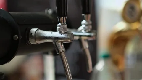 Slow motion close up of bartender hands pours beer into a plastic glass. Close Stock Footage 279551004