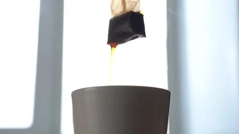 Slow Motion Close-up Black Tea Brewing in a White Mug Stock Footage 150454159