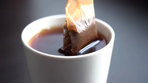 Slow Motion Close-up Black Tea Brewing in a White Mug Stock Footage 167213185