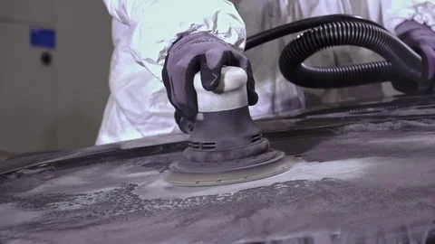 Slow motion close up of blue collar worker using sander Stock Footage 112008371
